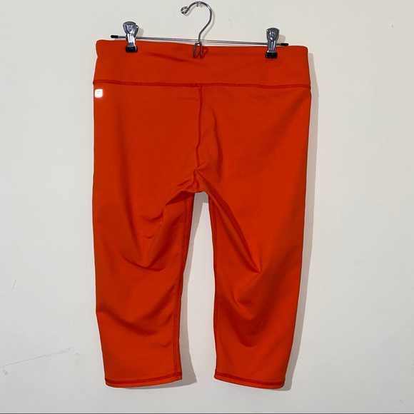 Fabletics orange mid rise power hold cropped pants - Picture 5 of 9